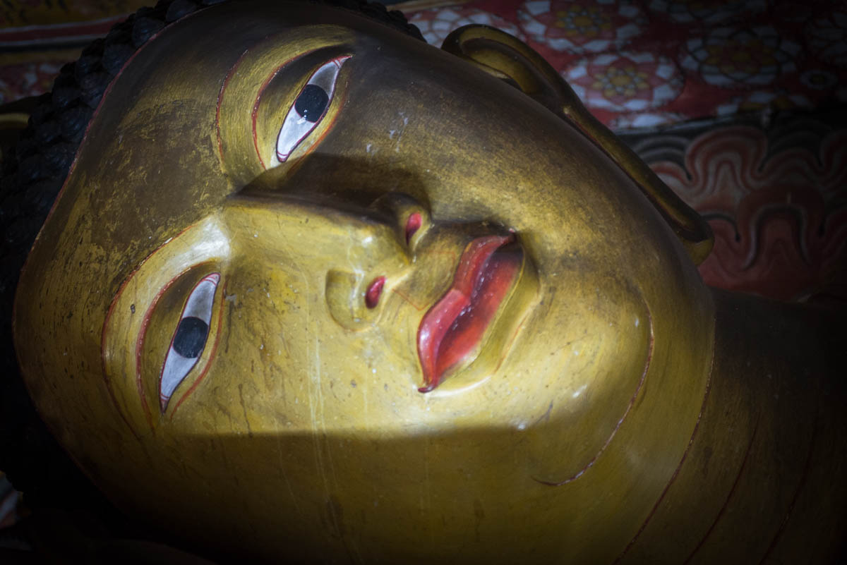 Face of the Buddha carved from rock